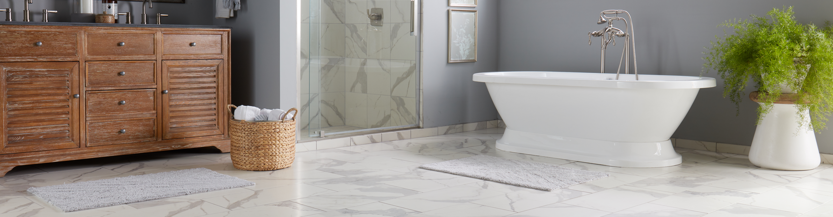 marble tile flooring and shower wall in a bathroom